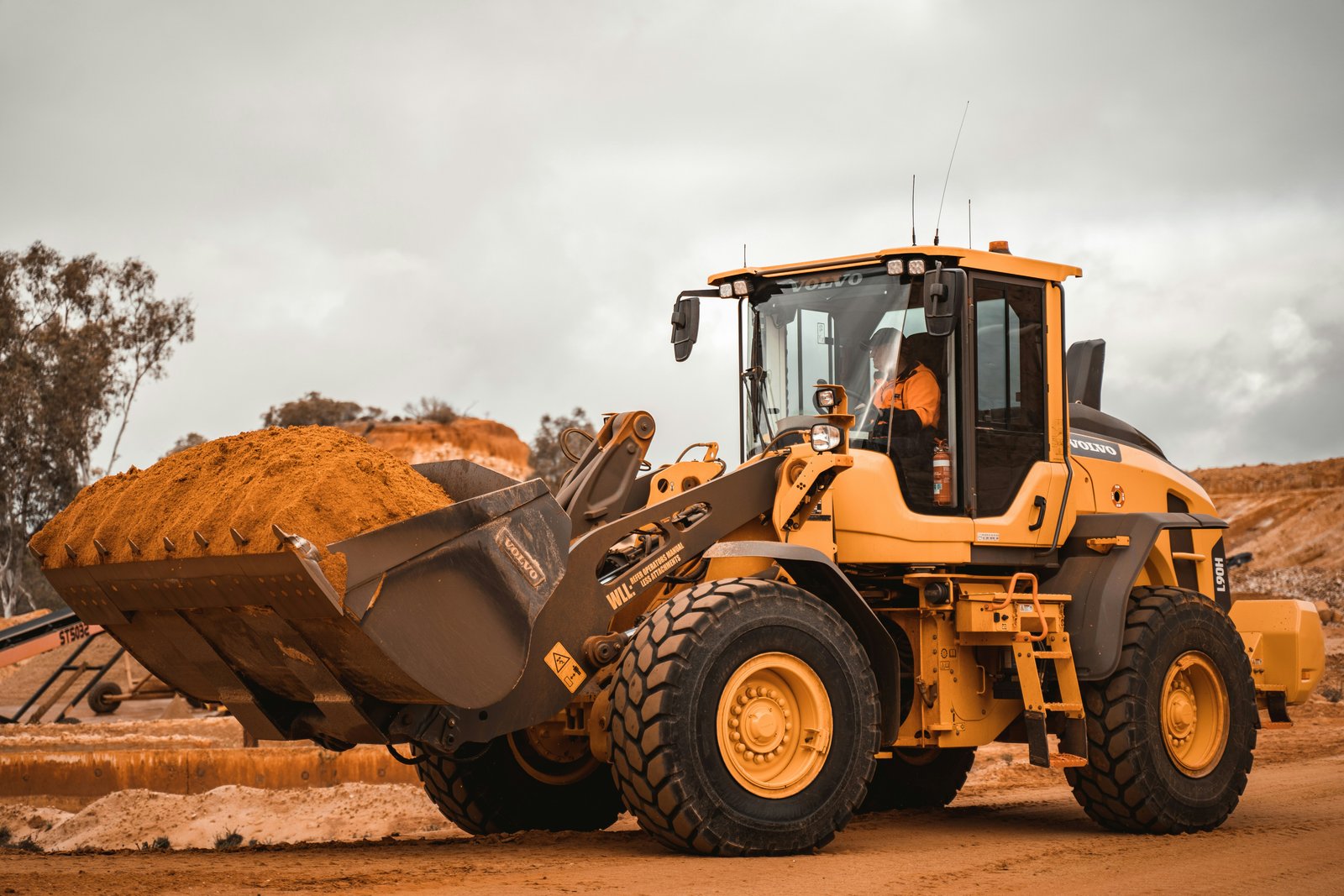 PRGT wheel loader carrying earth on construction site